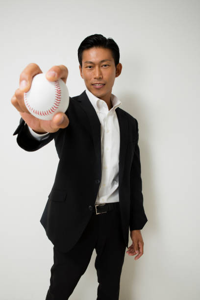 istock Businessman with a baseball ball 657533442
