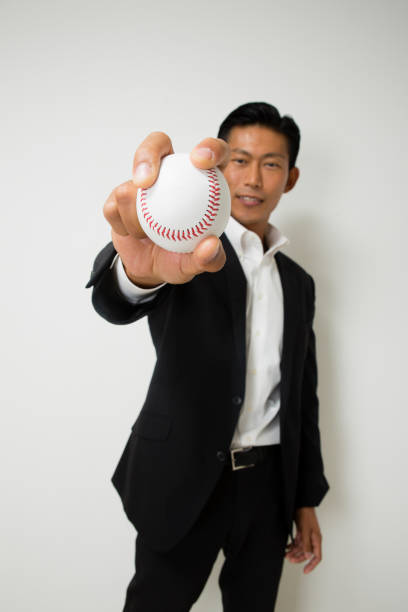 istock Businessman with a baseball ball 657533448