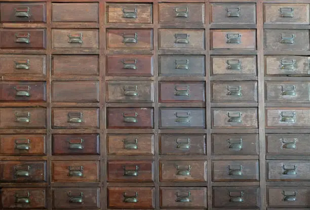 Photo of primitive wooden apothecary or catalog cabinet