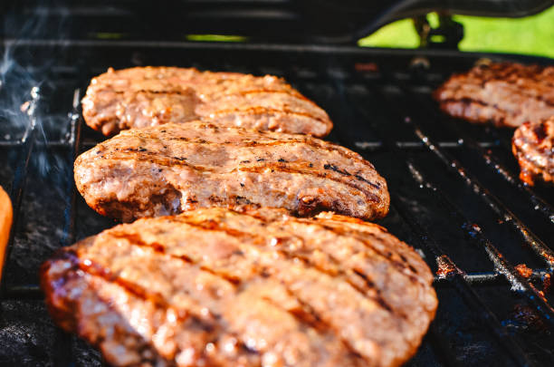 istock Cooking hamburgers on a grill 657536274
