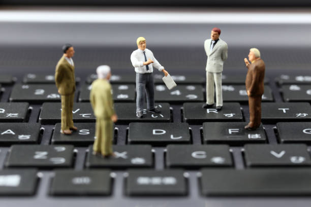 istock Businessman laptop keyboard and miniature 657536402