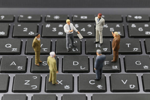 istock Businessman laptop keyboard and miniature 657536416