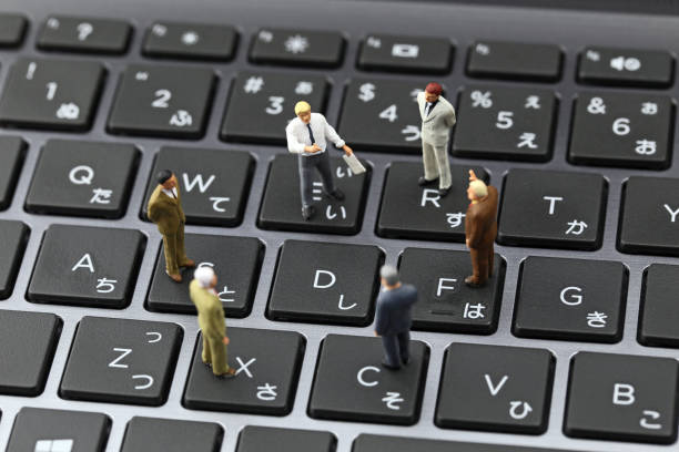 istock Businessman laptop keyboard and miniature 657536428