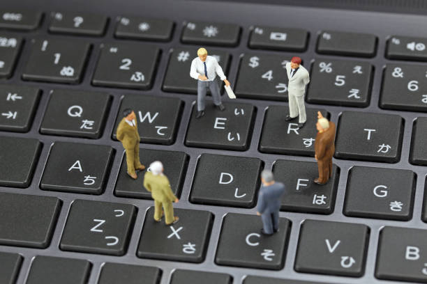 istock Businessman laptop keyboard and miniature 657536432