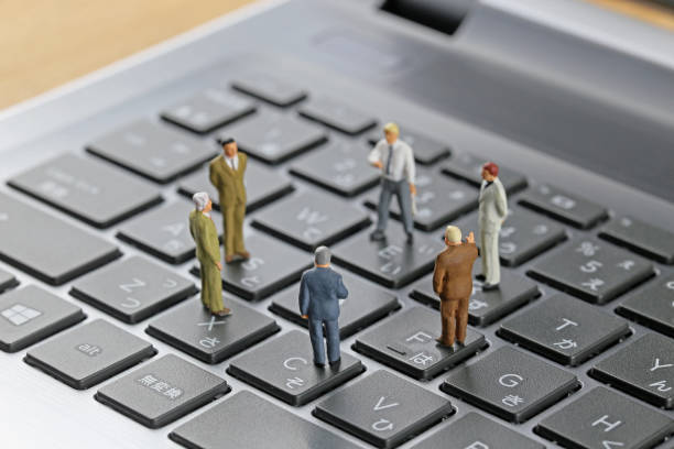 istock Businessman laptop keyboard and miniature 657536440