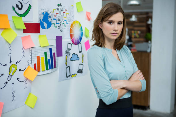 istock Female graphic designer standing with hands crossed 657537074
