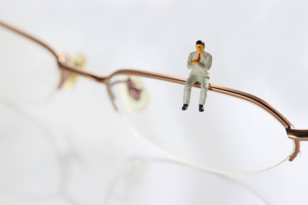 istock Businessman in glasses and miniature 657543576