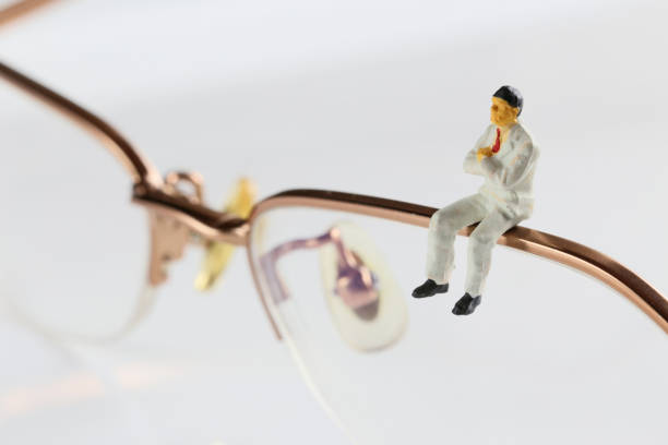 Businessman in glasses and miniature