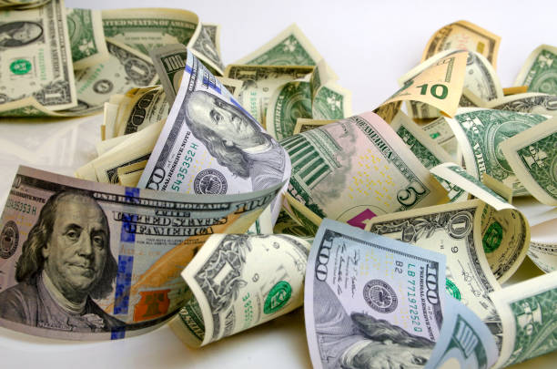 istock Crumpled bills of dollars of different dignity. 657546090