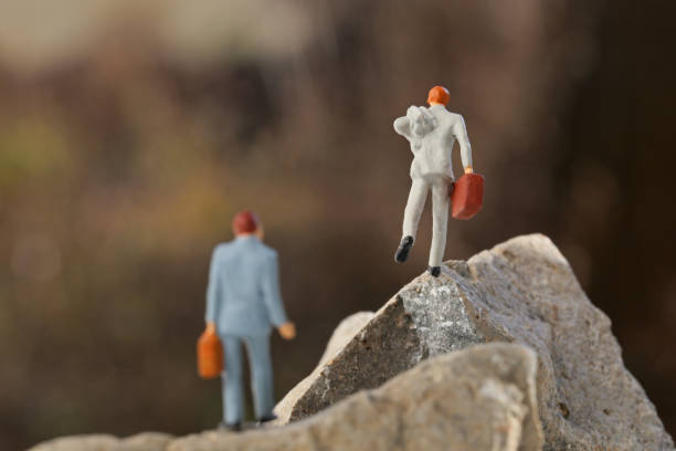 istock Miniature rock to get past corporate 657546686