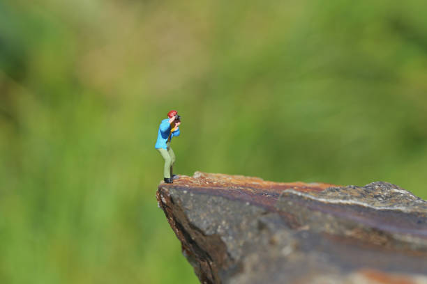 istock Miniature cliff of photographers 657546722