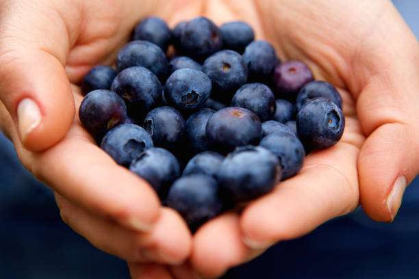 istock Handful of blueberries 657546968