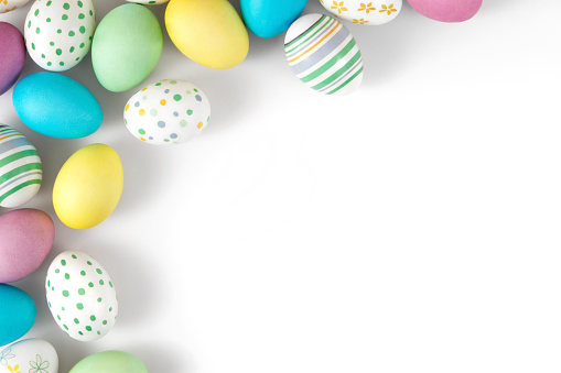 Group of colourful easter eggs on white background.