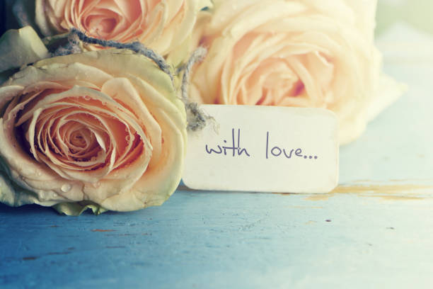 istock Bouquet of roses on wooden board. 657556808