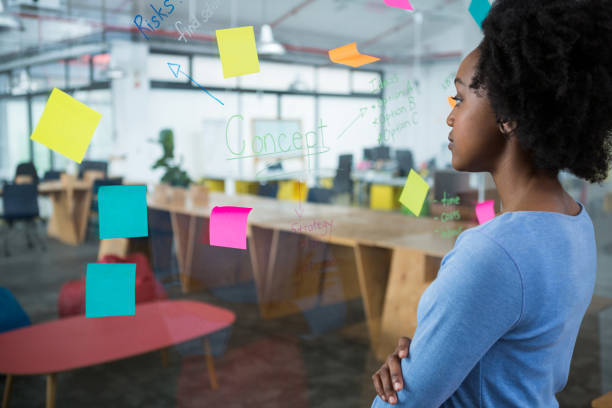 istock Female graphic designer looking at the glass 657557878