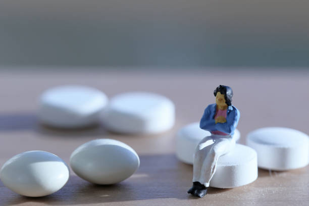 istock Women white tablets and miniature 657558106