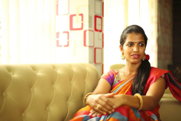 istock Hindu Woman Sitting on Sofa 657563034