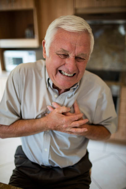 istock Senior man suffering from heart attack in the kitchen 657563378