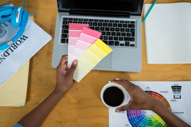 istock Female graphic designer holding color swatch 657563456
