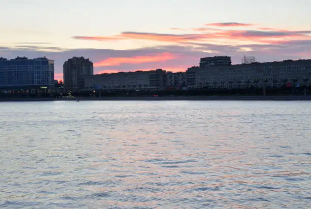 Photo of Silhouette of the Sverdlovskaya embankment before dawn.