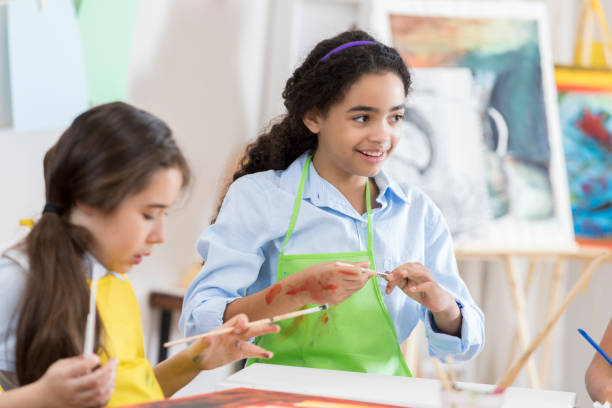 istock Diverse girls take art lesson 657565316
