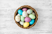 Easter Eggs on White Wooden Table Background