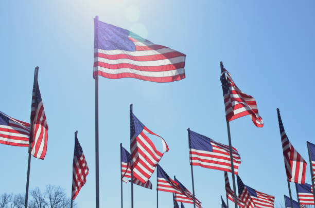 istock American flags in wind rippling on flag poles 657567676