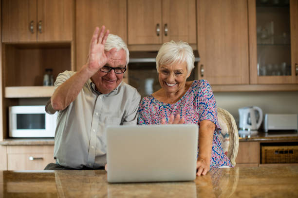 istock Senior couple using laptop in the kitchen 657571718
