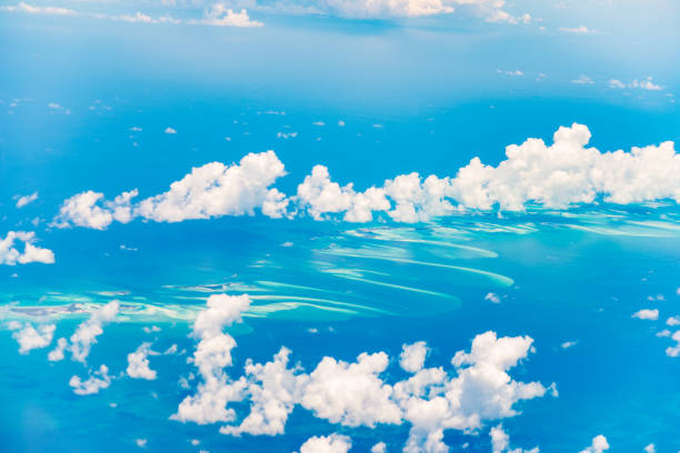 Aerial view of the Bahamas, stunning islands, sand bars and coral reefs with turquoise sea, shot from aeroplane.