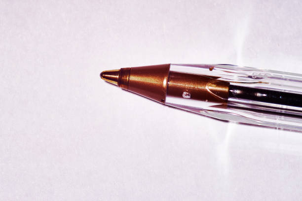 Studio shot of a modern ballpoint pen. Material is plastic. The color is red and black . Isolated on a white background.
