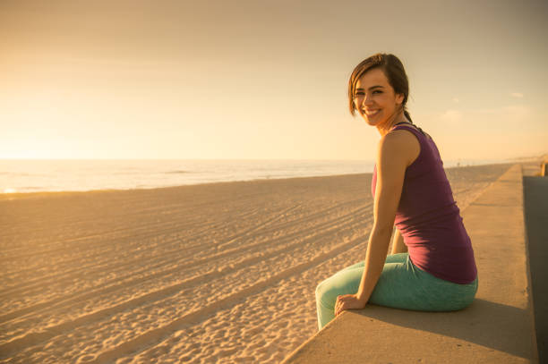 istock Young Women Watching The Ocean Sunset 657595450