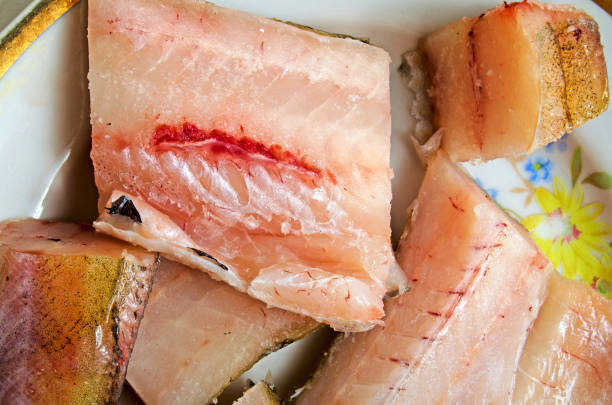 istock Preparation of pollock for frying. 657605566