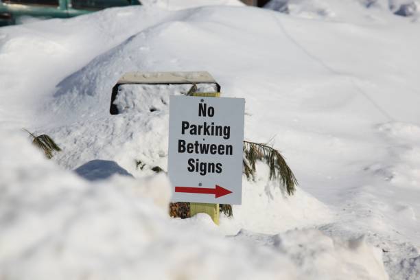 istock Sign indicating no parking between signs but it would be impossible to park as there is too much snow 657606026