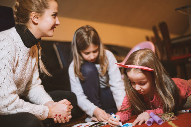 istock Mother with kids painting 657606218