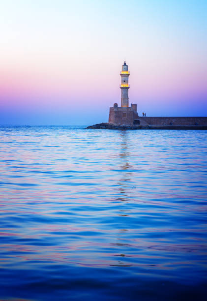 istock lighthouse of Chania at pink sunset, Crete 657609288