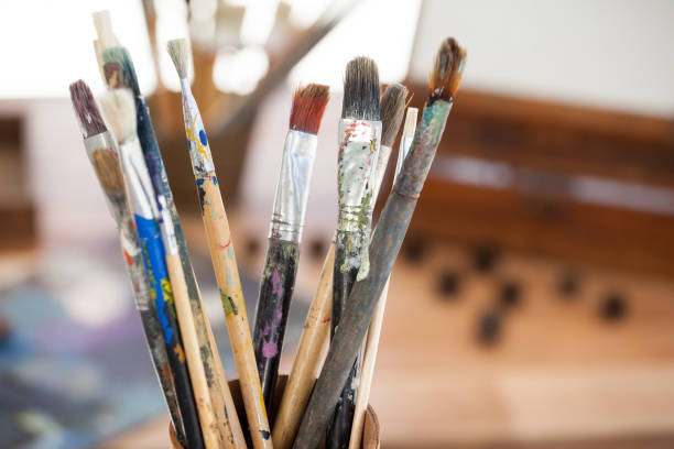 istock Set of paint brushes in a jar 657612628