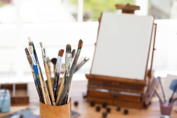 istock Set of paint brushes in a jar 657612666