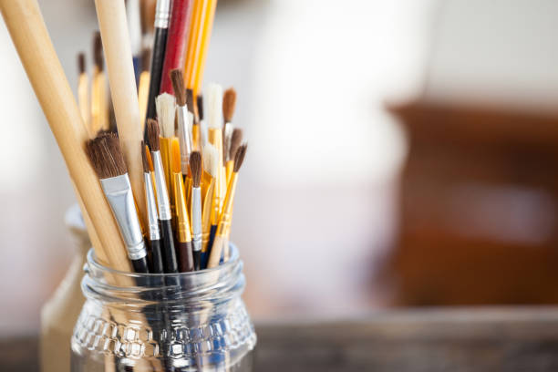 istock Set of paint brushes in a jar 657612718