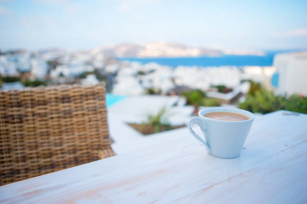 istock Coffe on the table on summer empty openair cafe with sea view 657615760