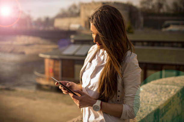 istock Young woman using a digital tablet outdoor 657616318