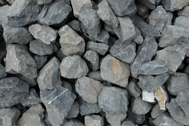 aggregate of very large coarse gray stones, crushed at a stone pit, gravel pattern