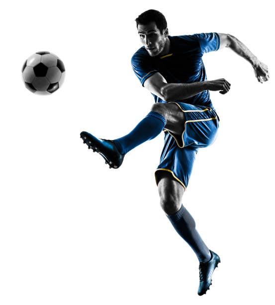 istock soccer player man kicking silhouette isolated 657620234