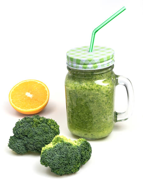 istock fresh fruit vegetable broccoli celery orange smoothie bottle shake isolated on white background 657634372