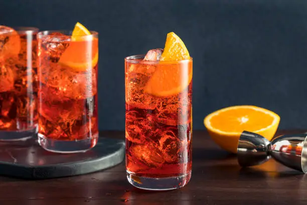 Refreshing Cold Americano Cocktail with an Orange Garnish