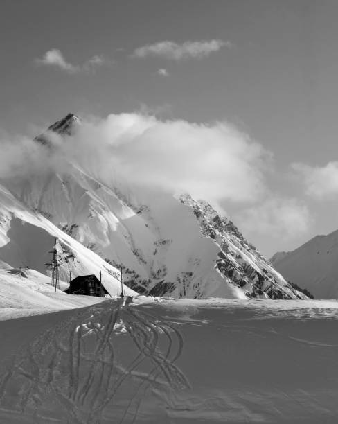 istock Black and white view on hotel at ski resort in winter 657640652