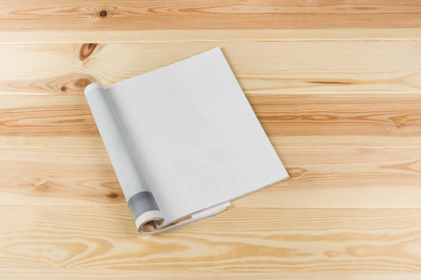 istock Mock-up magazines or catalog on natural wooden table background. 657643056