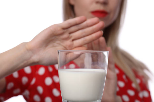 istock Lactose intolerance. Dairy Intolerant Woman refuses to drink milk 657643232