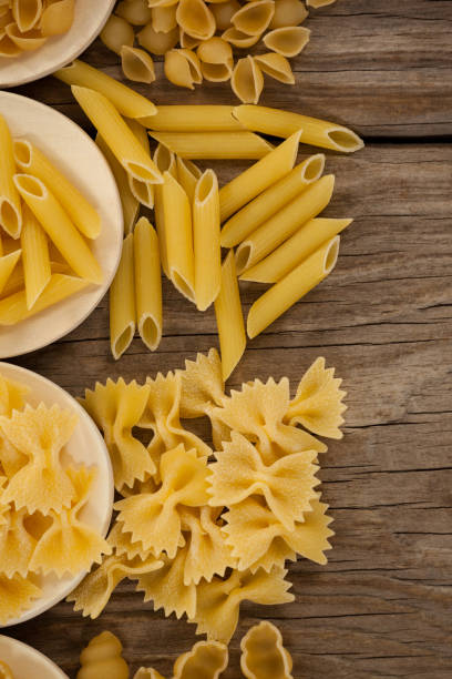 istock Varieties of pasta spilling out of spoons 657647272