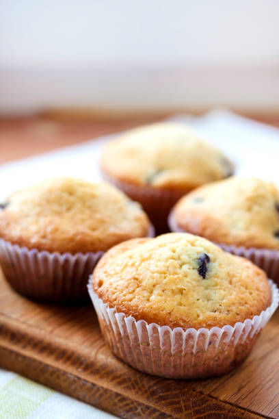 istock Homemade muffins with blueberries on a wooden board 657649510