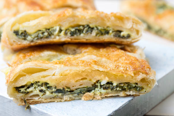 istock Spinach and cheese pie slices on a tray 657654154